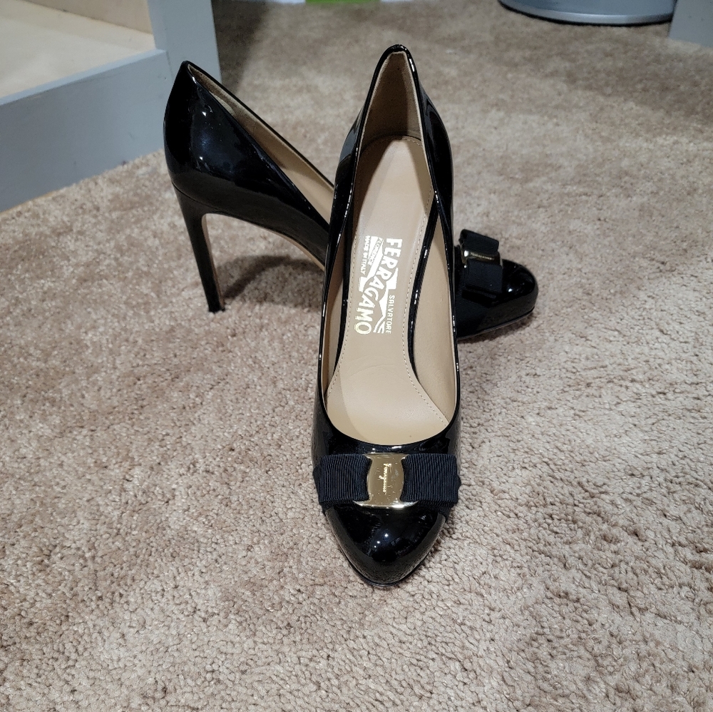 Salvatore Ferragamo patent leather high heel platform pumps.